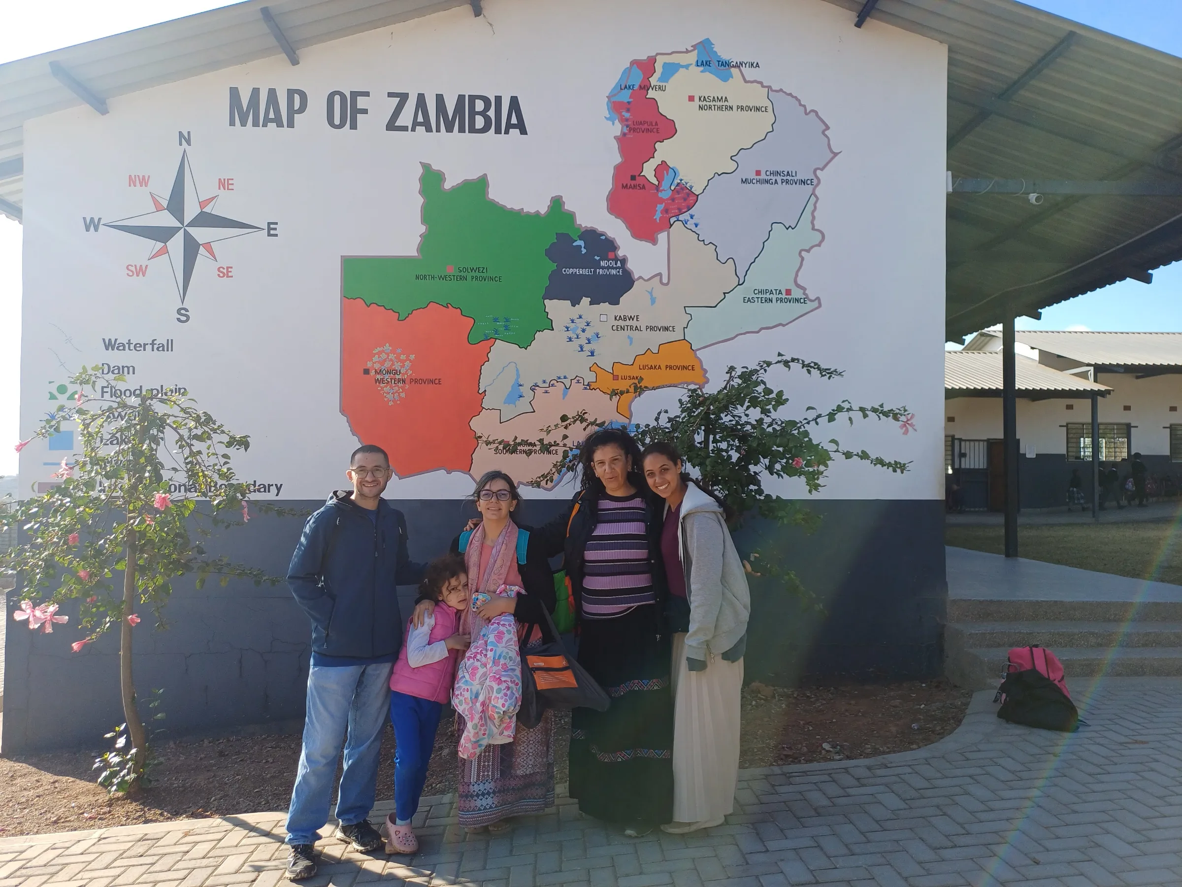 The Egyptian team infront of the Zambian map